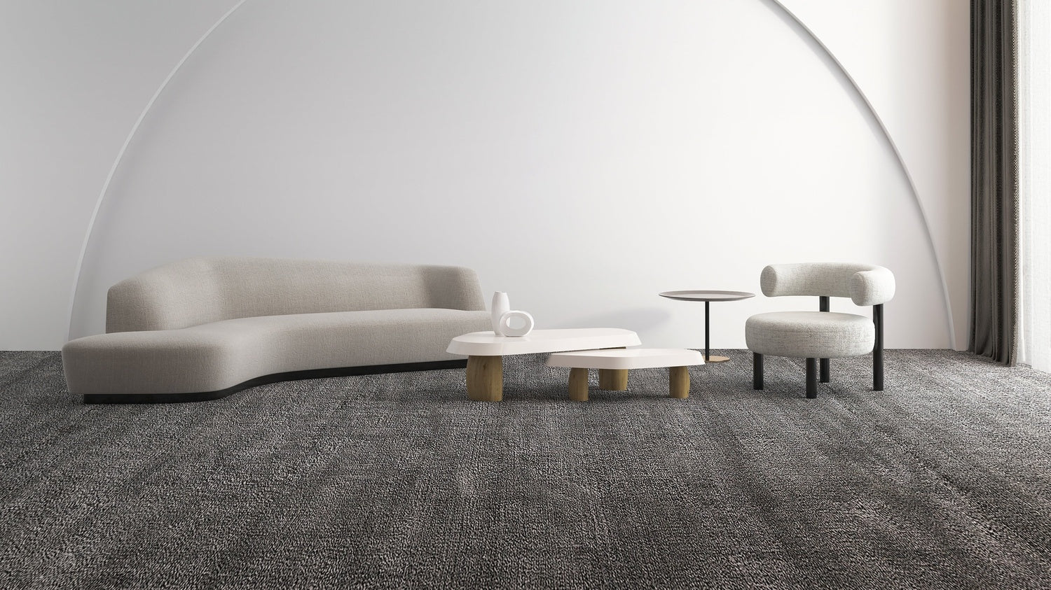 Modern living room with a curved sofa, coffee table, and chairs on a gray carpet.
