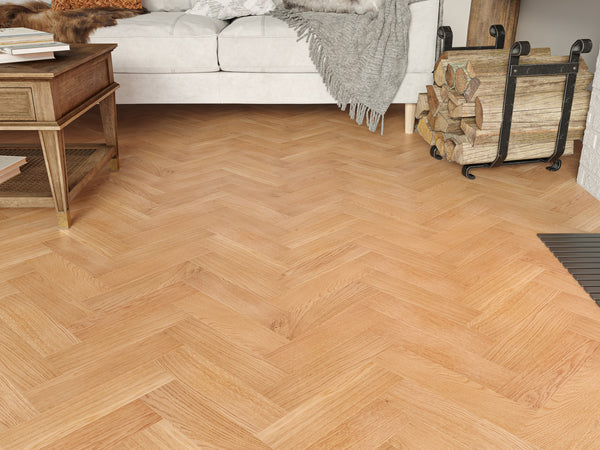 Wooden floor with a herringbone pattern in a living room setting.