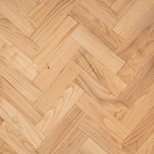 Close-up of a wooden floor with herringbone pattern
