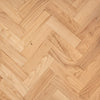 Close-up of a wooden floor with herringbone pattern